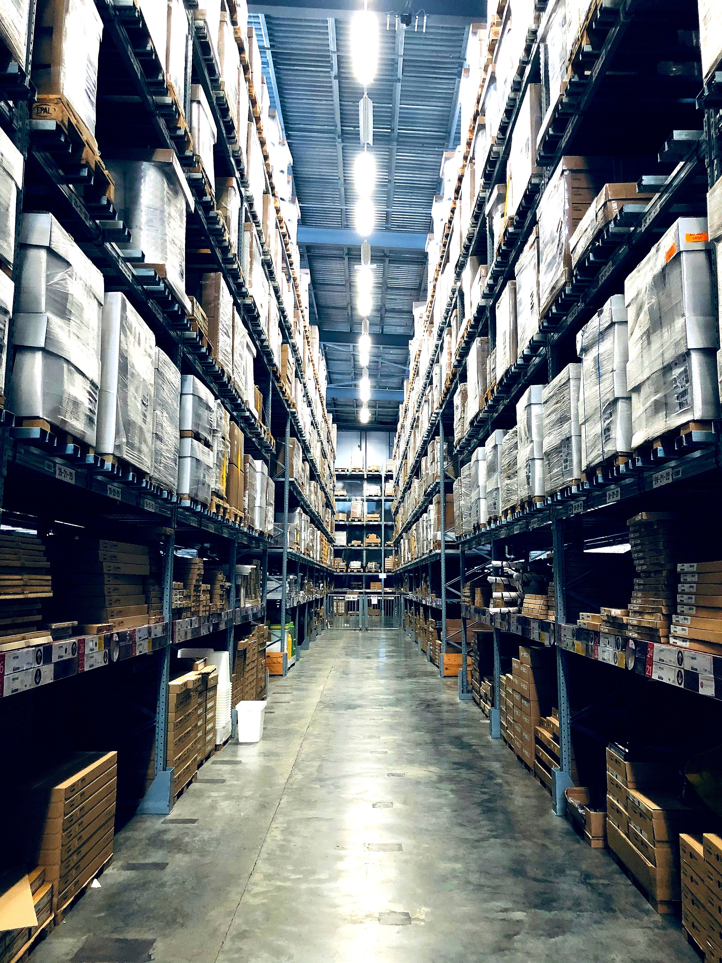 A modern distribution warehouse, representing enterprise and prime-contractor supply